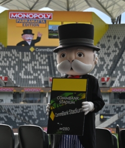 Mr Monopoly holding the CommBank Stadium card art
